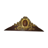 Old wooden pediment stucco