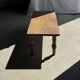 Brown Indonesian teak coffee table, with a border and cylindrical legs H40 L103.