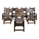 Set of 8 Gothic-style chairs in oak and studded leather.