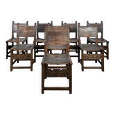 Set of 8 Gothic-style chairs in oak and studded leather.