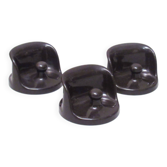 Three brown coat hooks Olaf von Bohr Kartell