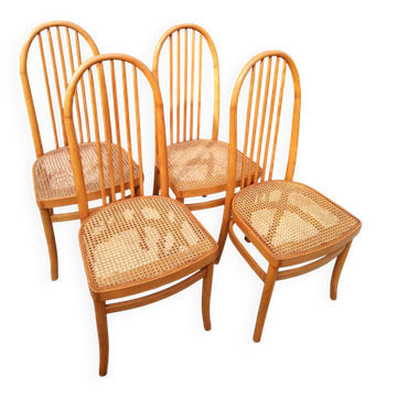 Set of 4 vintage Baumann chairs in honey wood and cane.