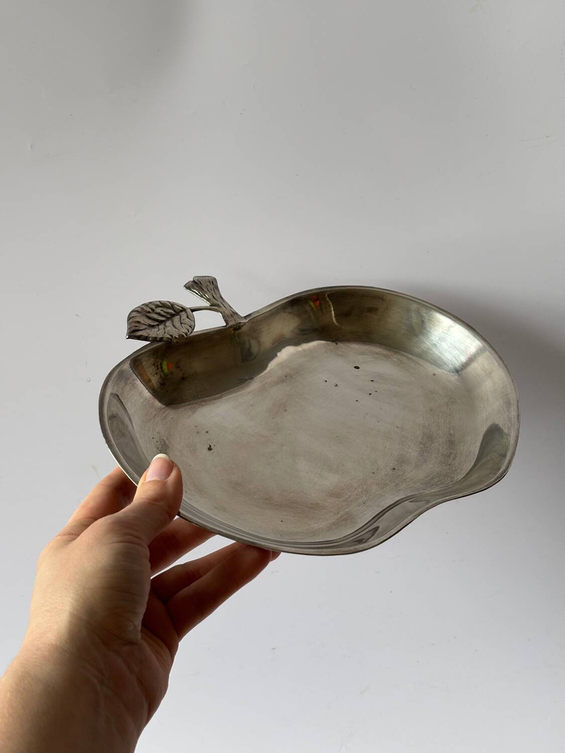 Silver metal apple pocket emptier