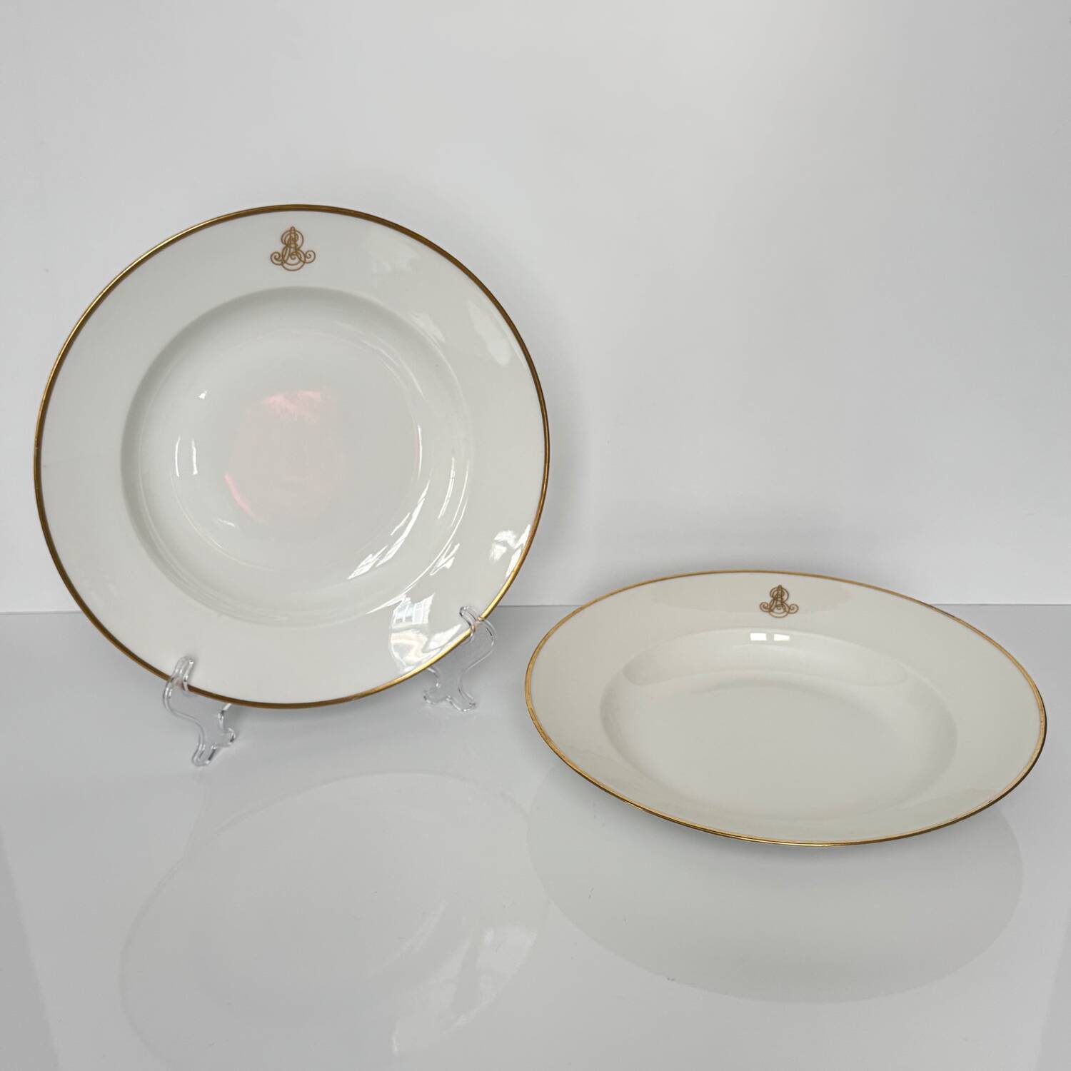 Set of monogrammed plates with gilt edges | E. Bourgeois | Late 19th century