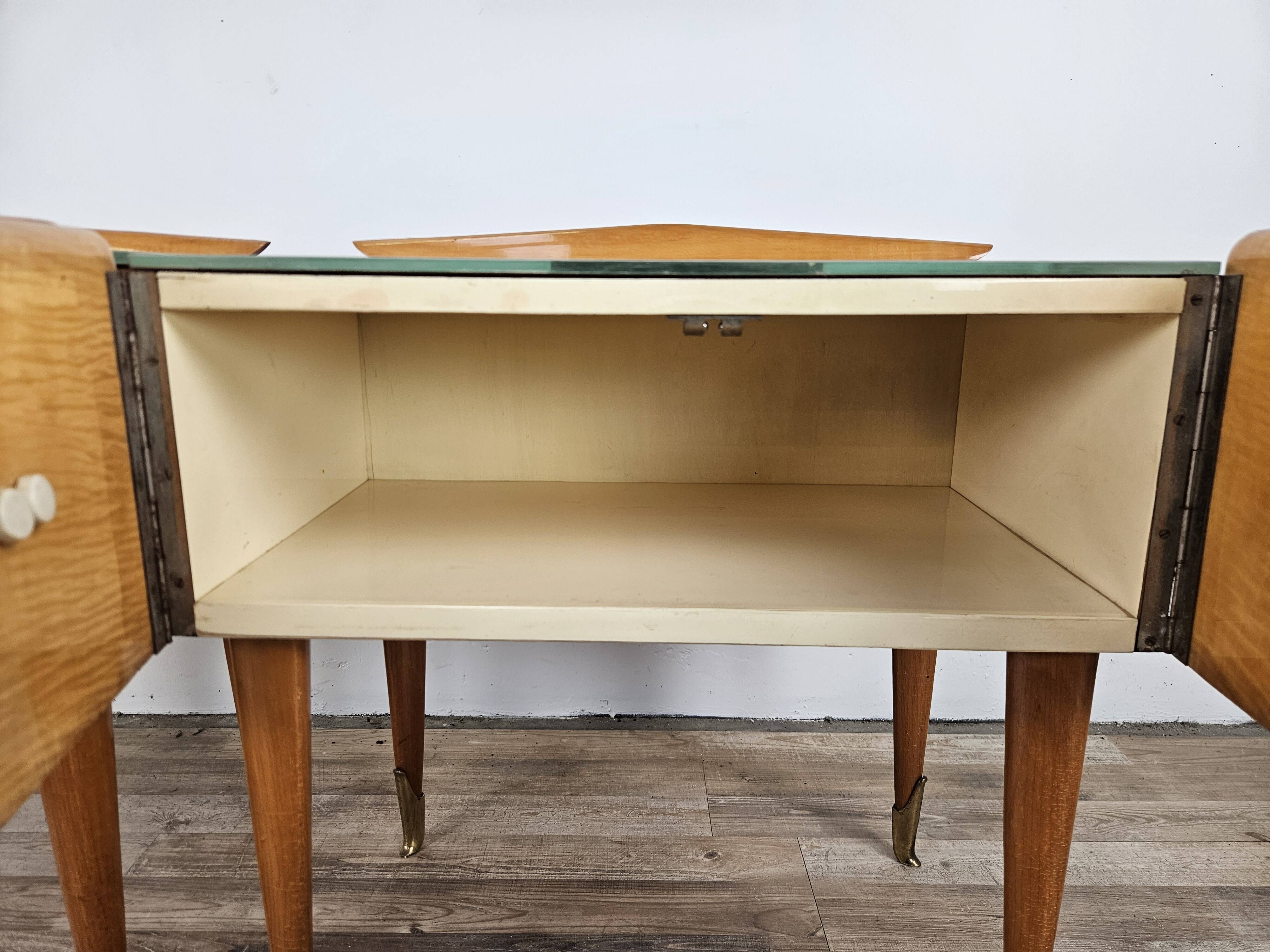 Mid-century nightstands in maple, brass, and glass