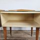 Mid-century nightstands in maple, brass, and glass