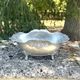 Footed pewter champagne cooler on claw feet with floral relief