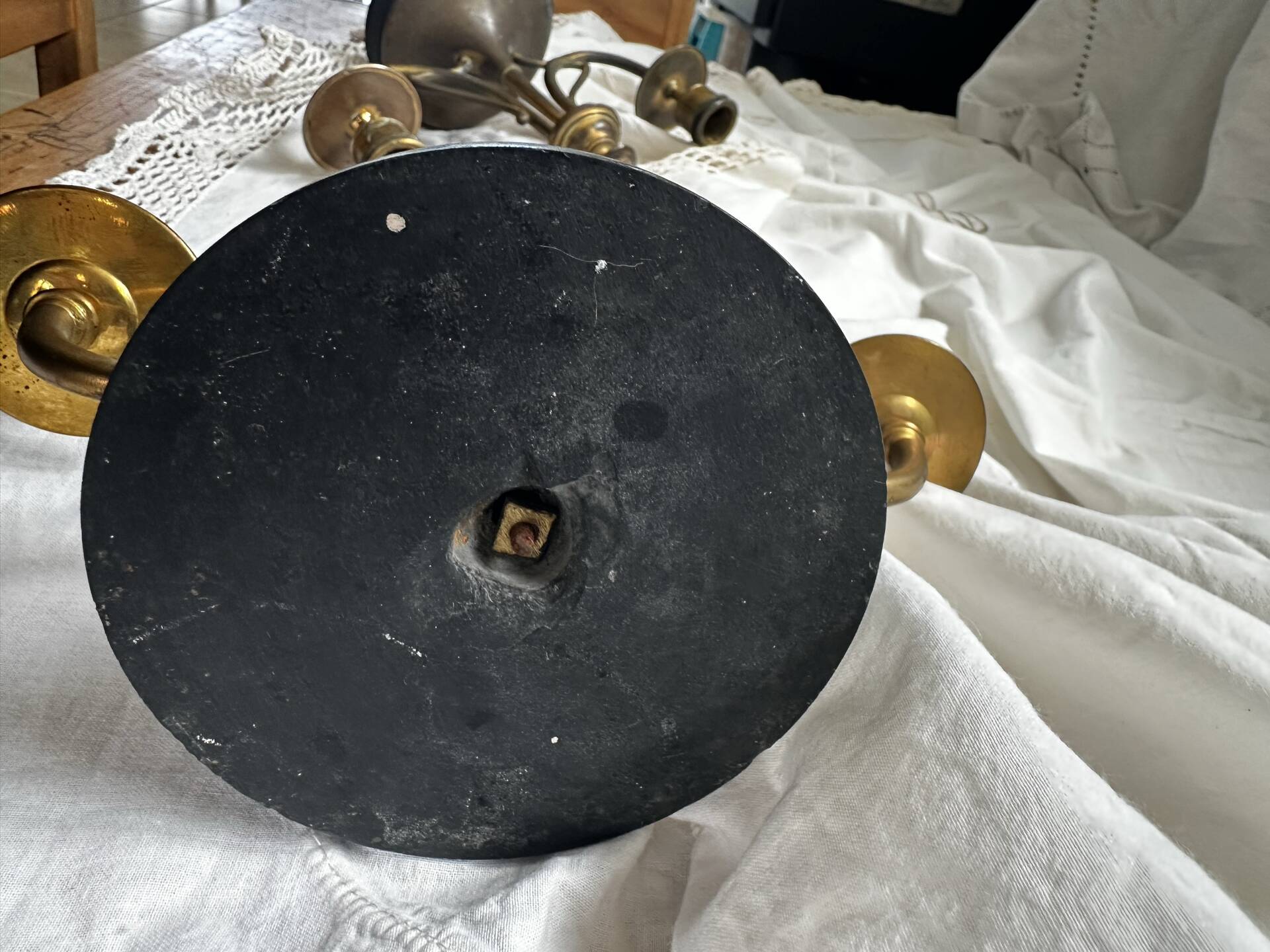 Pair of Empire style candlesticks, patinated brass and black stone.