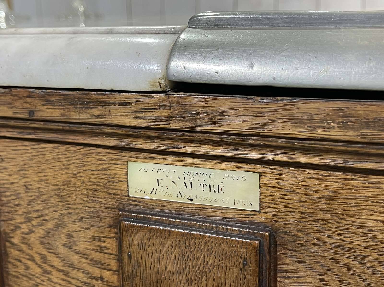 Bar counter in oak, zinc, and white marble from the early 20th century.