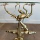 Coffee table model with cranes surrounding a brass bonsai and round glass top by Willy Daro.