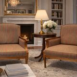 Armchair in the style of Louis XVI made of solid wood, striped fabric.