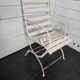 Old wrought iron and wood garden armchair