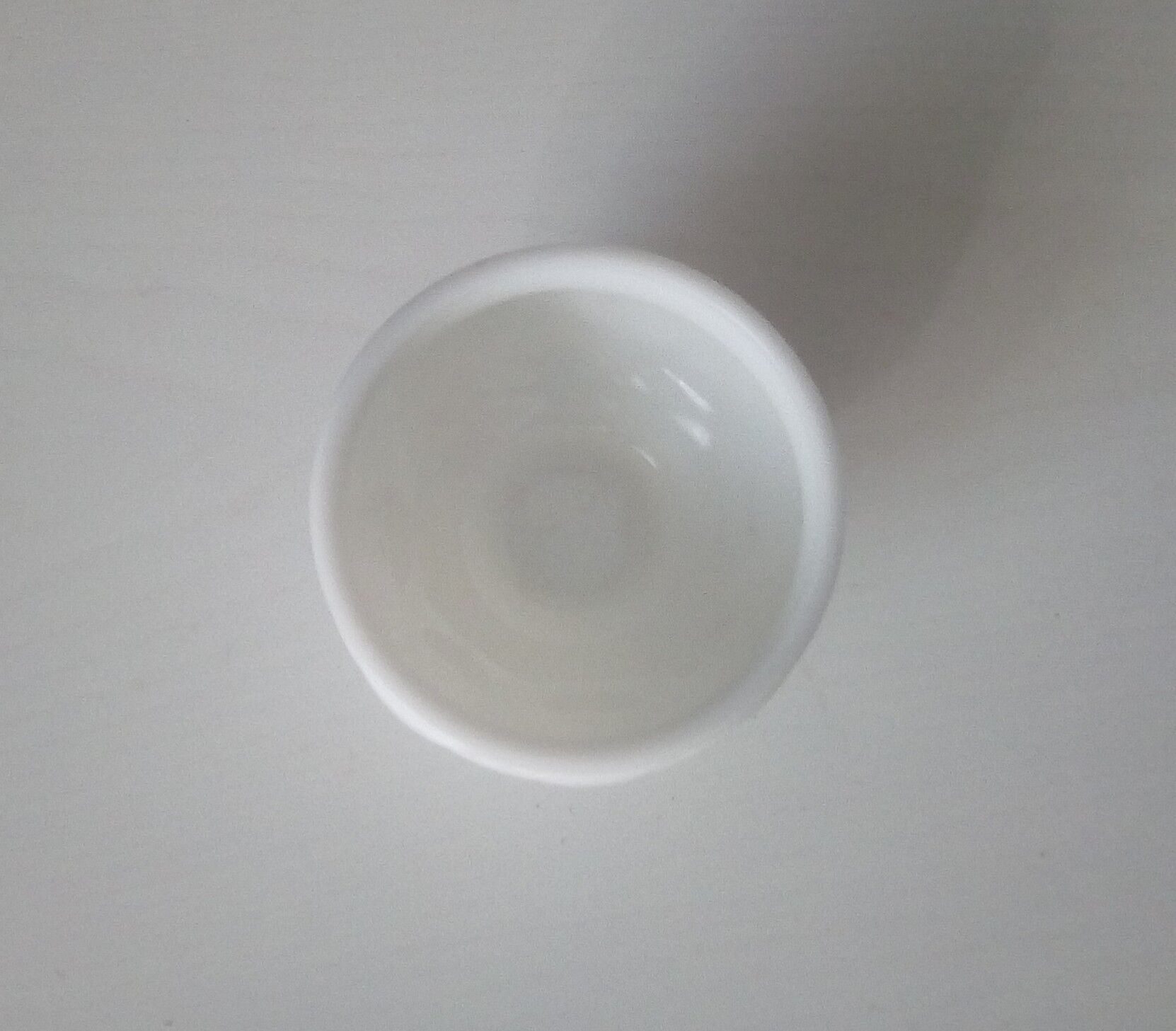 Old-footed cup in white opaline