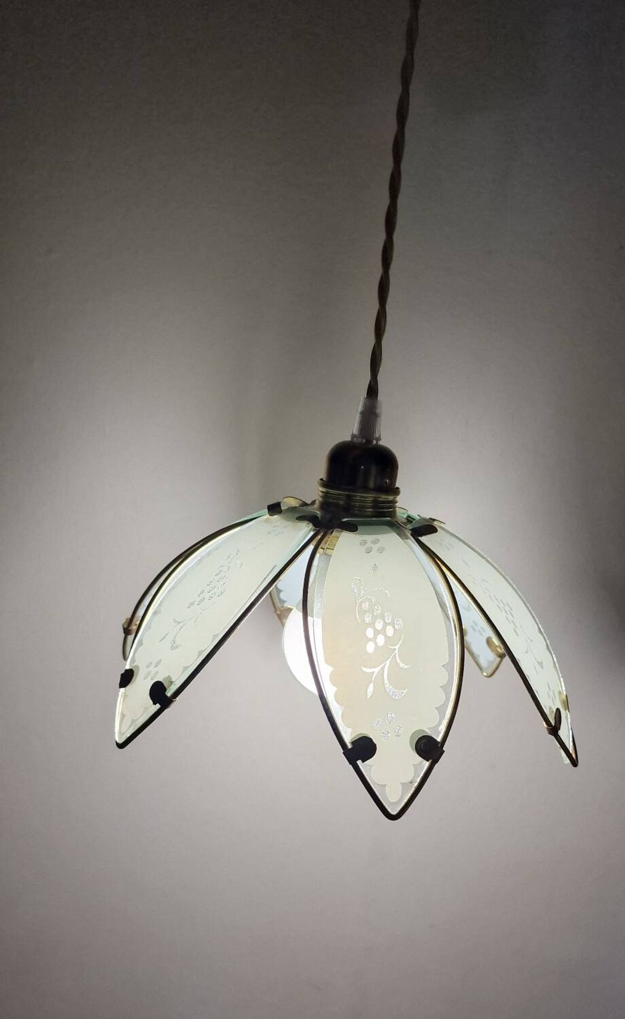 Glass flower rimmed with brass