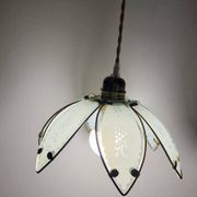 Glass flower rimmed with brass