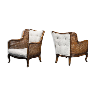 Pair of vintage 1930s boucle Vienna straw armchairs.