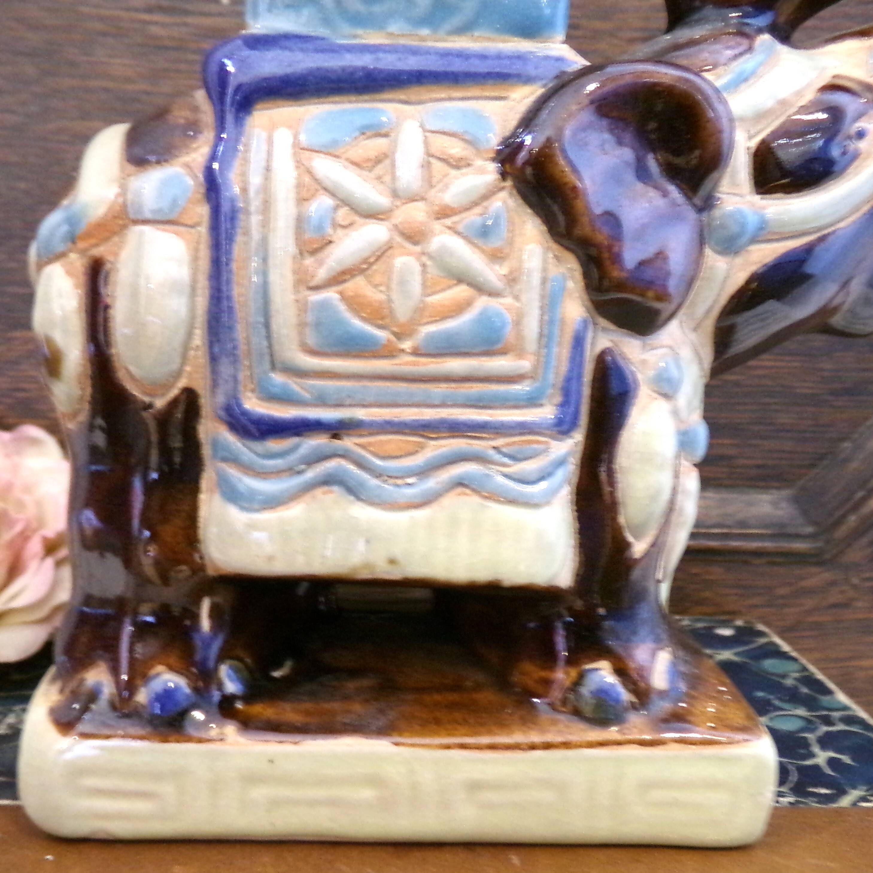 Small brown ceramic elephant vase