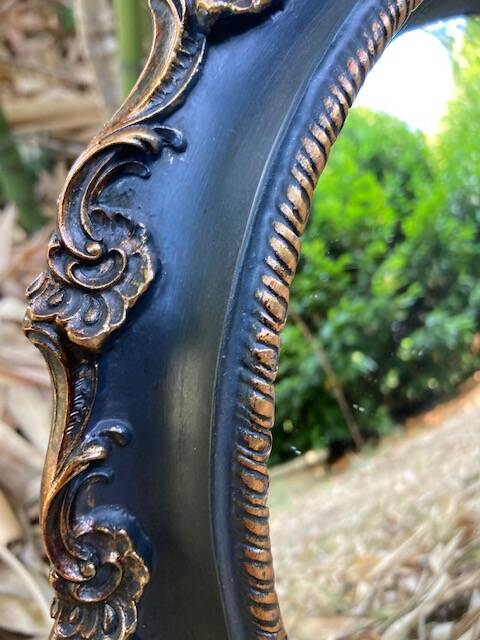 Convex mirror, also known as a witch's mirror.