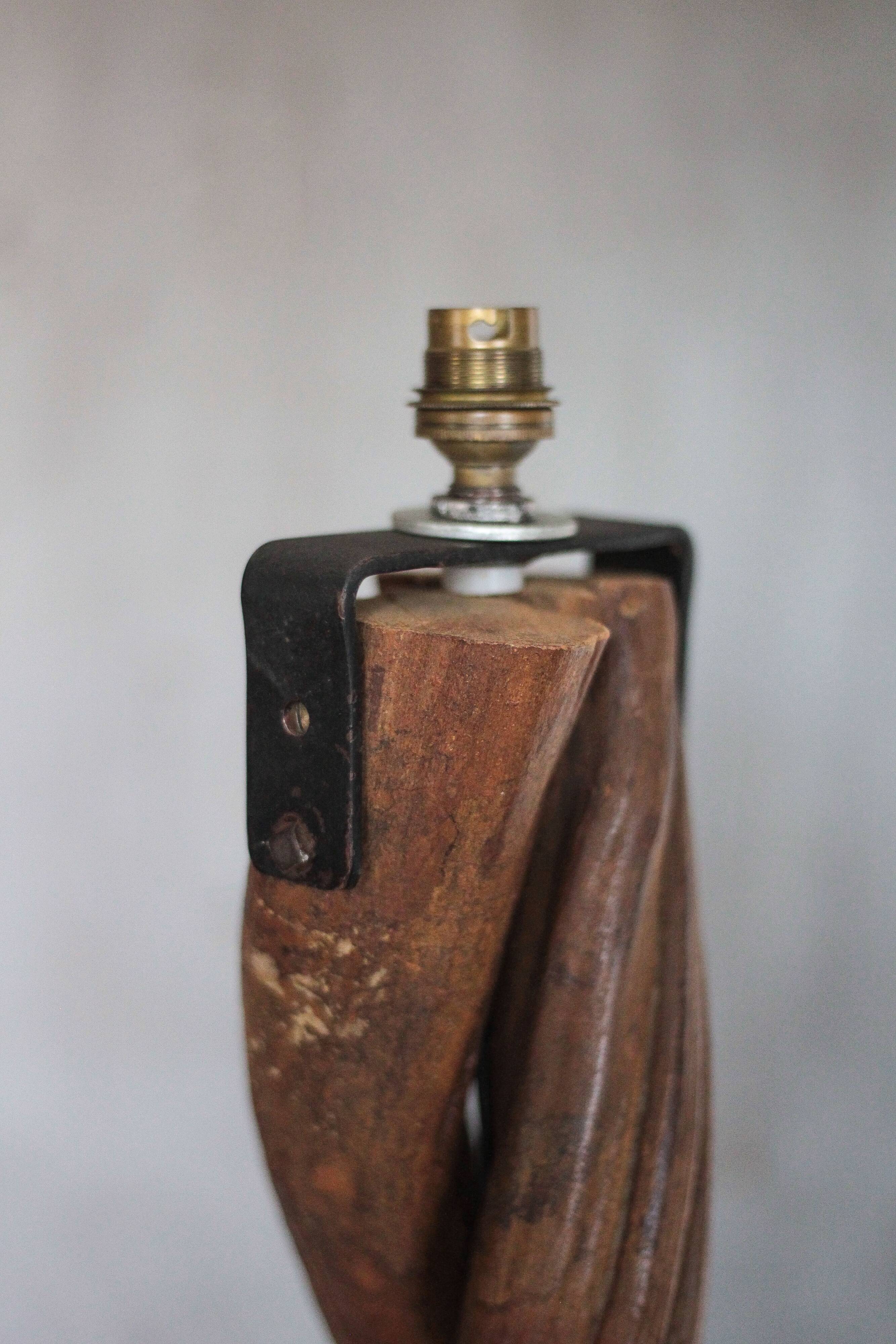 Liane and metal floor lamp with perforated leather shade featuring elephant patterns, lise.