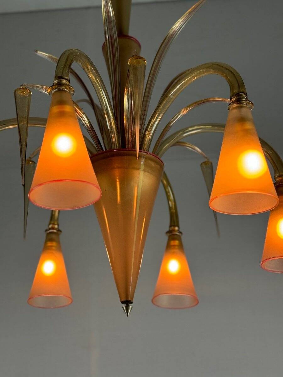 Venetian chandelier in beige/gray murano glass bordered with a red net