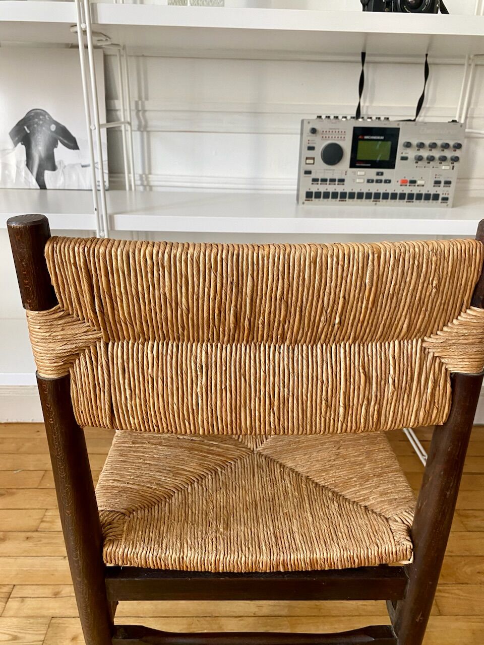 Wooden chair and brutalist straw