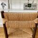 Wooden chair and brutalist straw