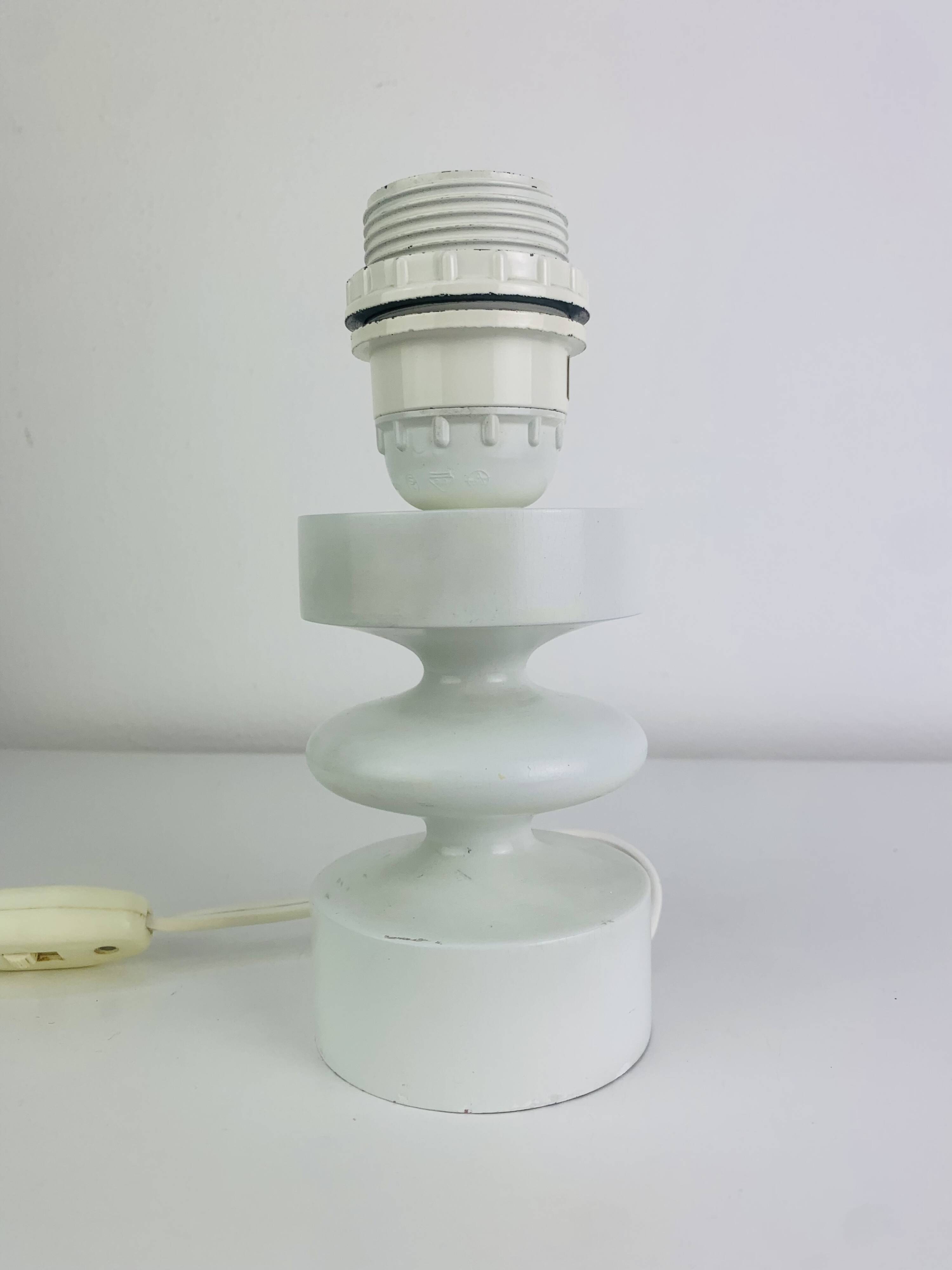 Temde lamp with turned wood and a seventies lampshade.