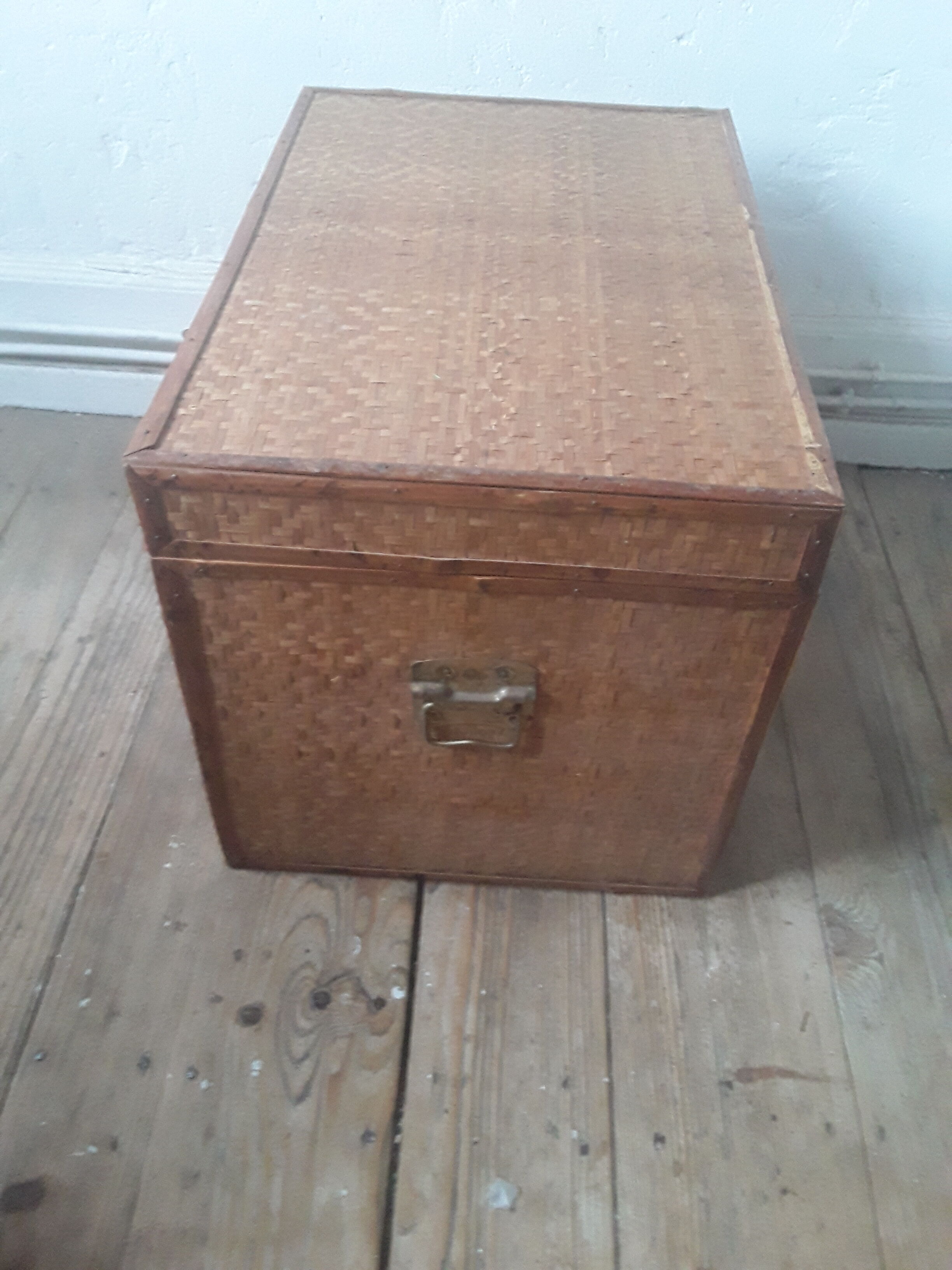 Wooden trunk with braiding