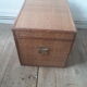 Wooden trunk with braiding