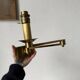 Pair of brass wall lights with articulated arms from the 70s