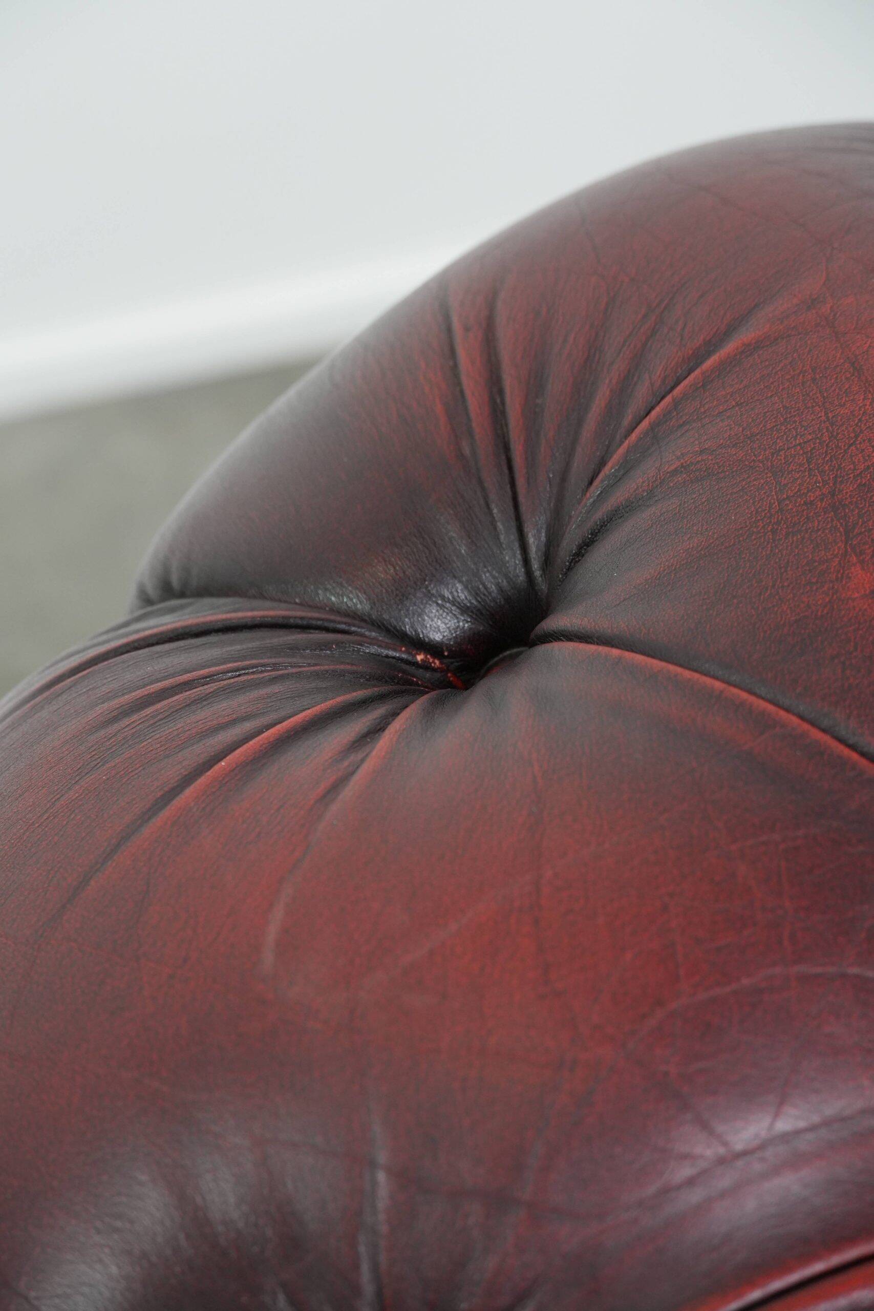 Classic cowhide Chesterfield button seat armchair in a beautiful red colour