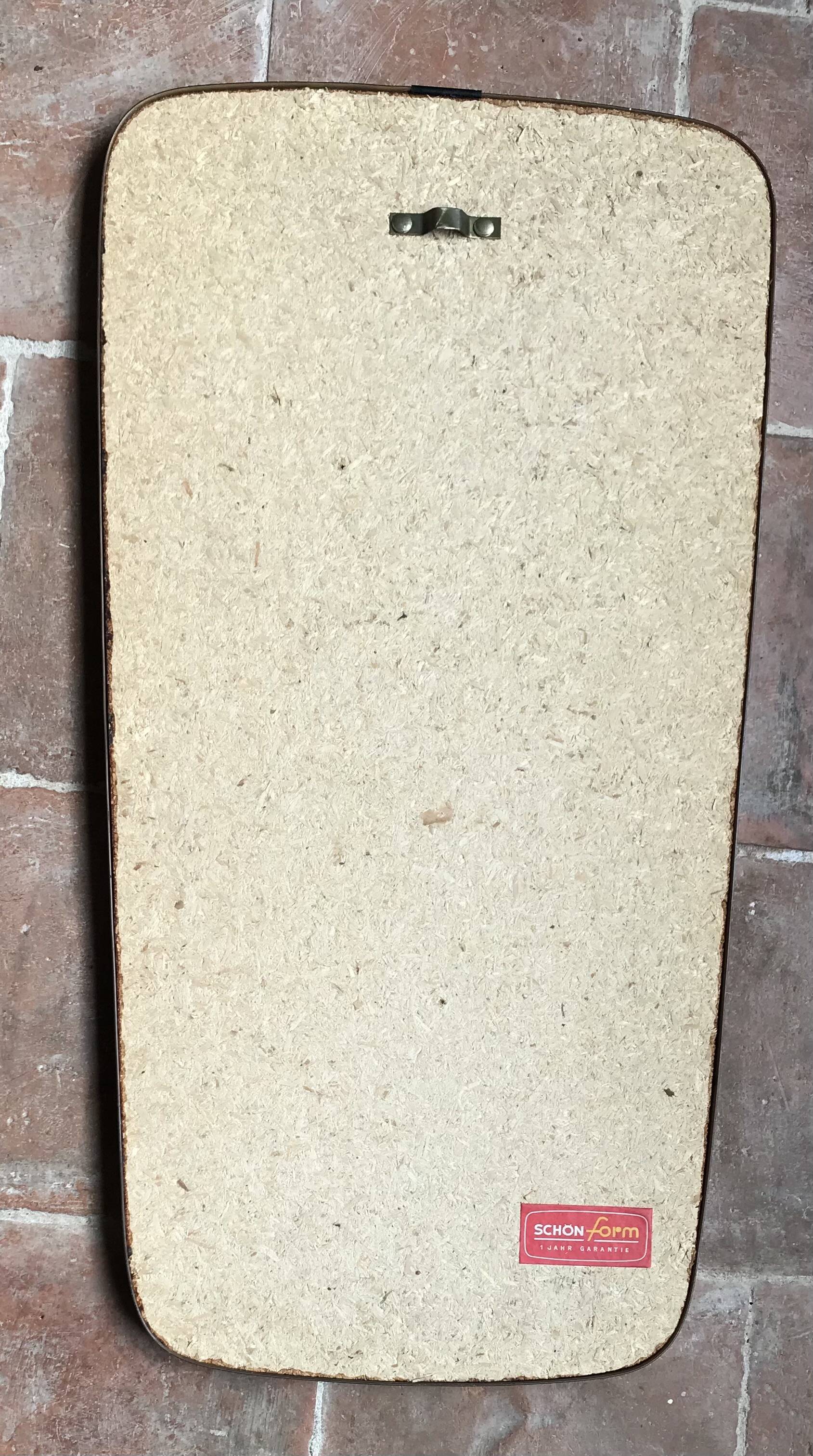 Vintage 1960 free-form mirror known as a rear-view mirror.