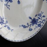 Antique serving dish in white and blue earthenware.