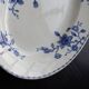 Antique serving dish in white and blue earthenware.