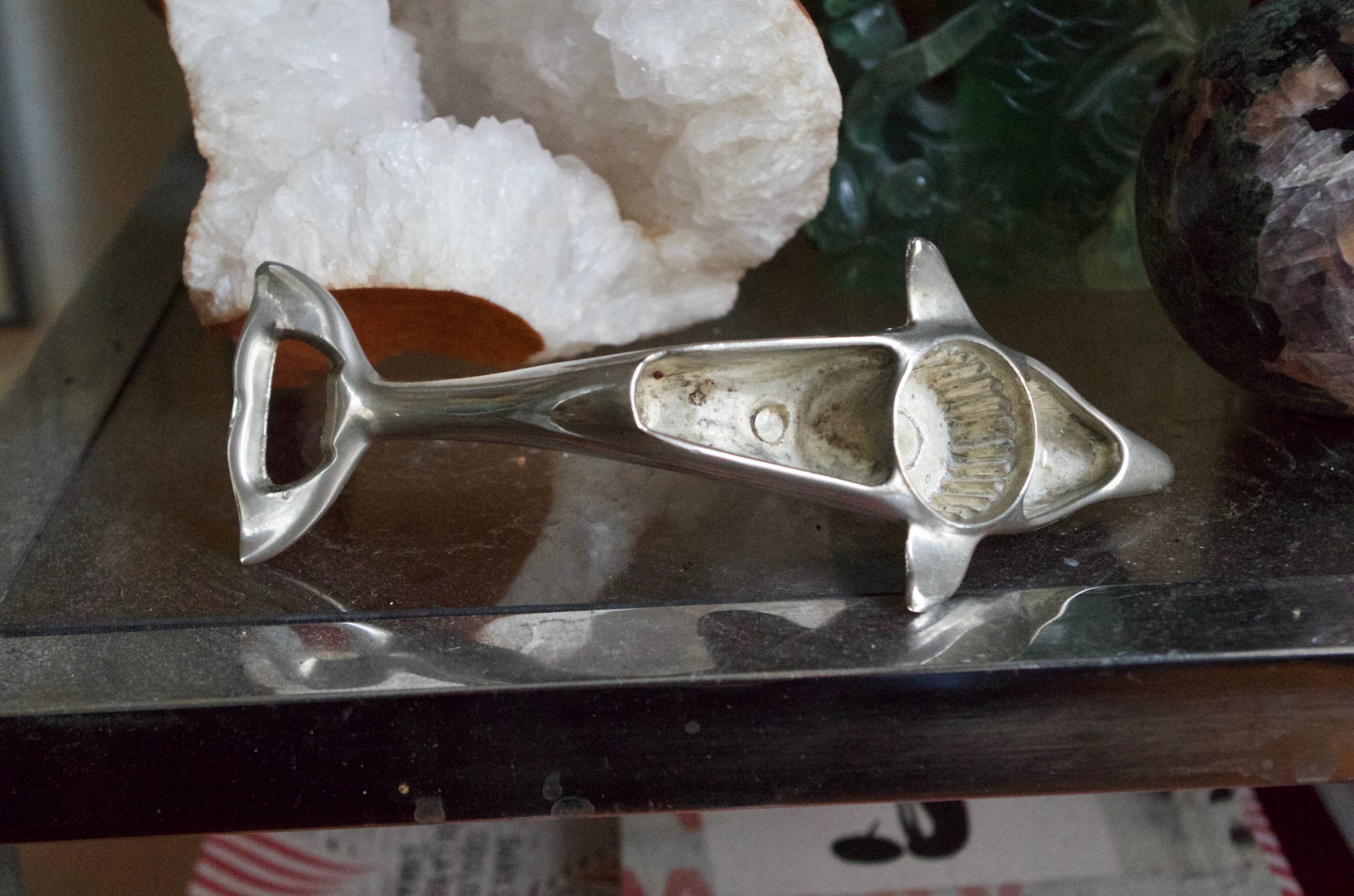 Vintage metal bottle opener dolphin