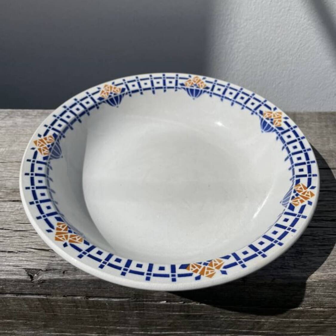 Round, shallow ceramic salad bowl from Saint Amand