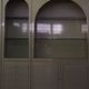 Showcases in lacquered wood, glass and brass  1970s, set of 4