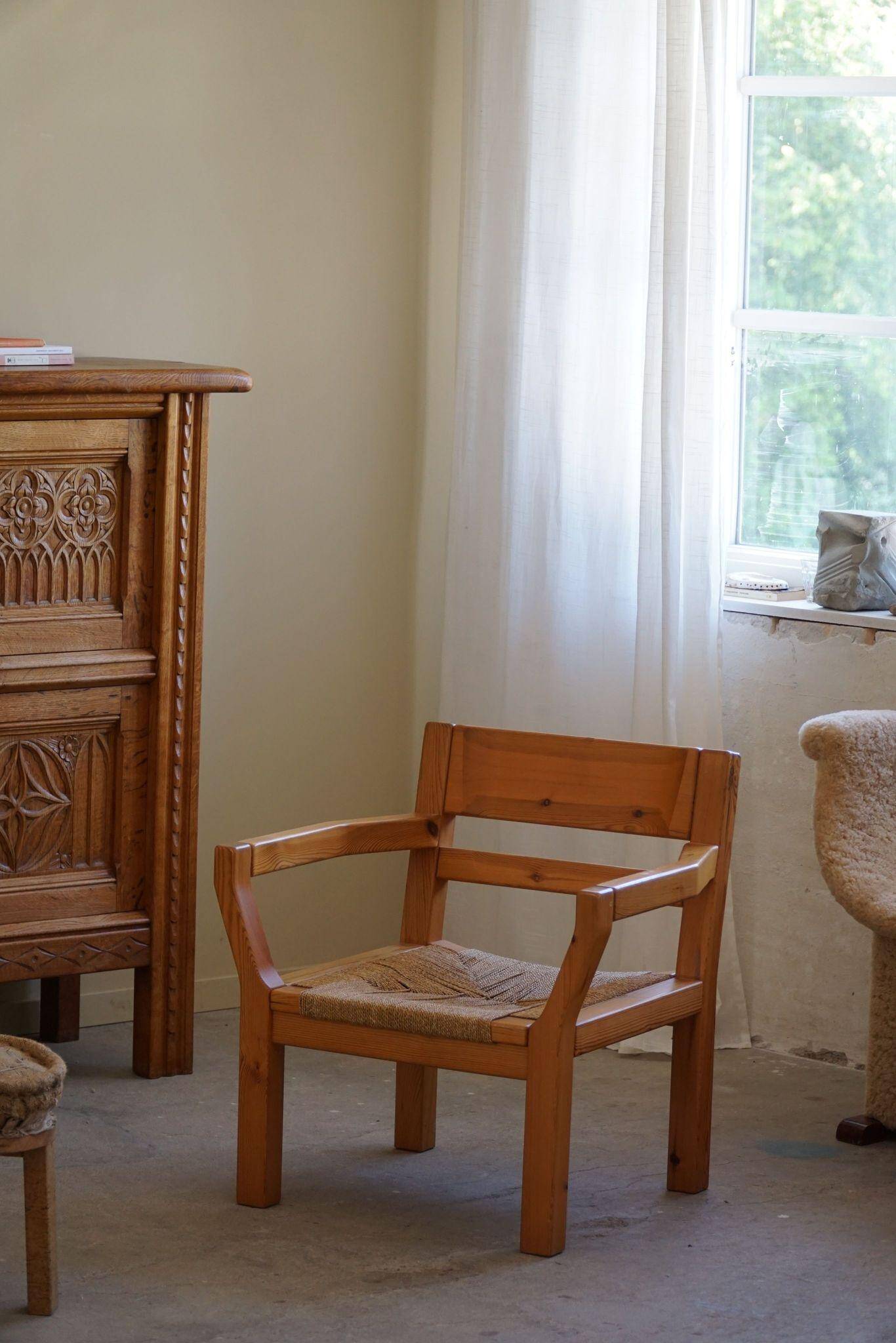 Tage Poulsen, a pair of brutalist chairs in pine and cord, Danish modern style, 1970s.
