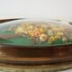 Domed glass frame with its bouquet of dried flowers