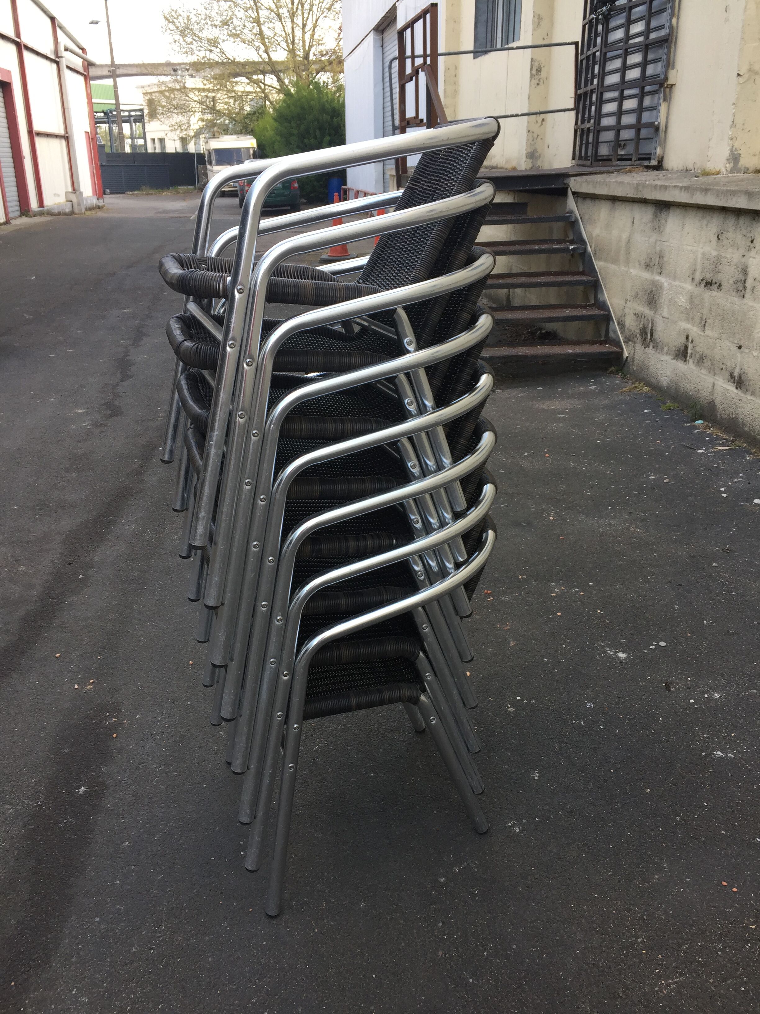 Eight Roland Vlaemynck aluminum coffee terrace armchairs (stackable)