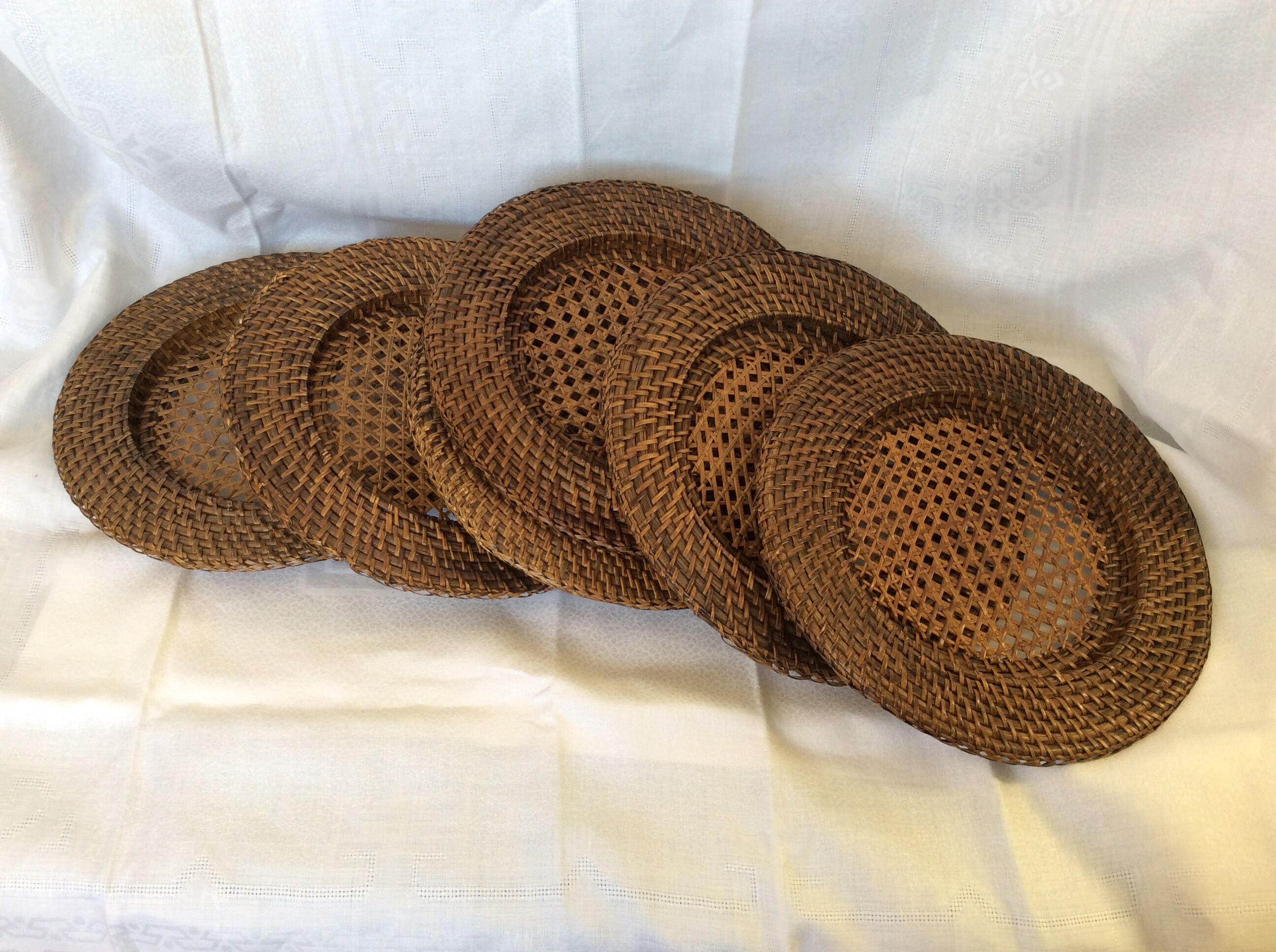 Six rattan under-plates, basketry, wicker