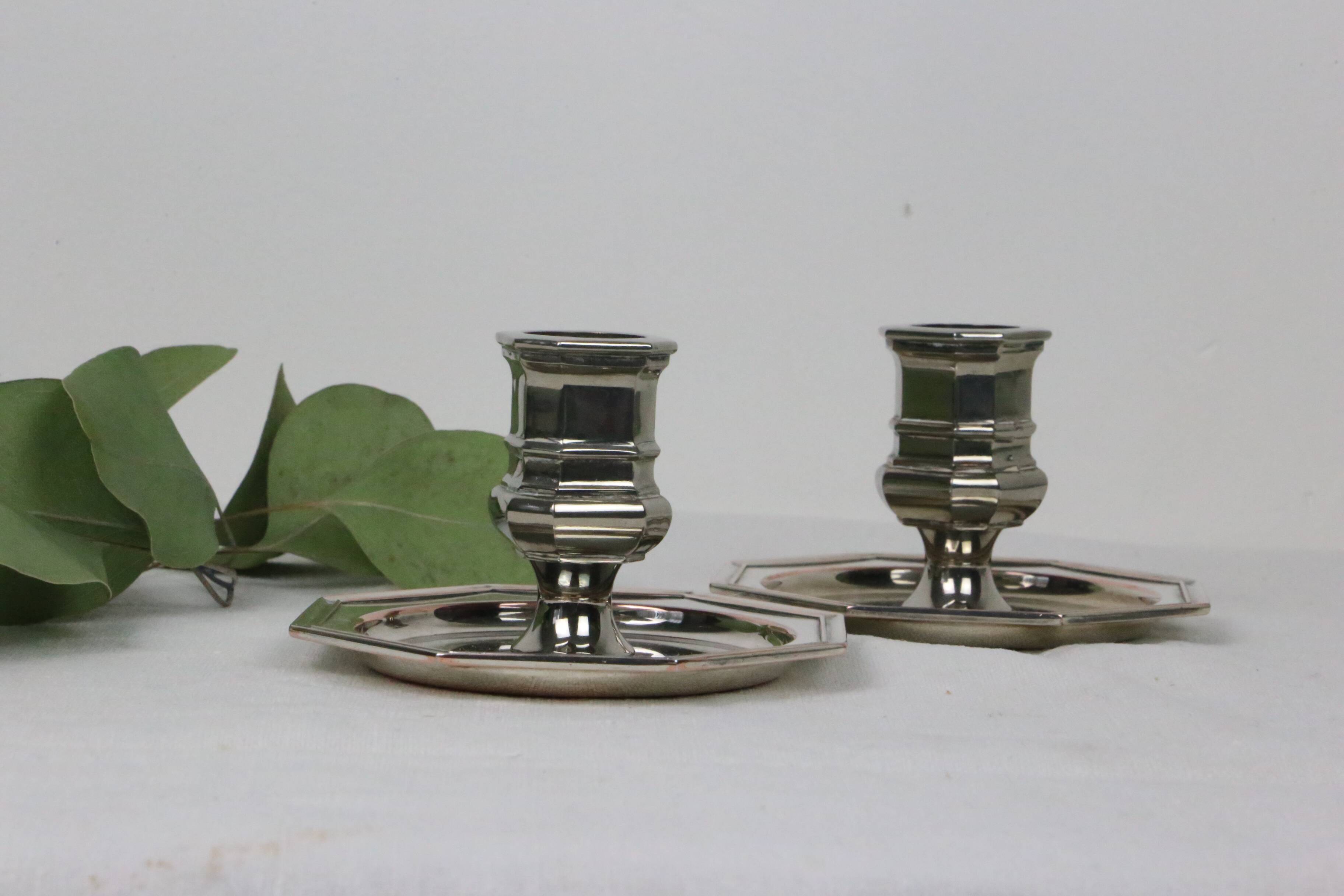 Pair of silver-plated metal candlesticks