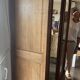 Walnut wardrobe with mirror doors.
