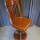 Swivel American chair in walnut and cast iron