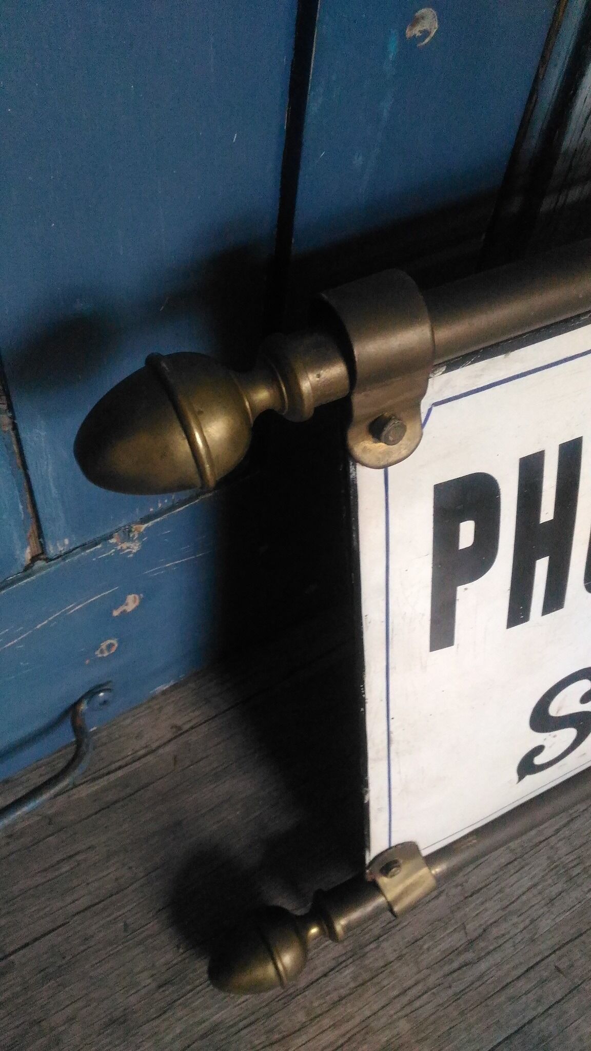 Photographer enamel sign