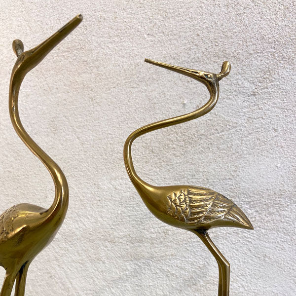 Couple of brass herons