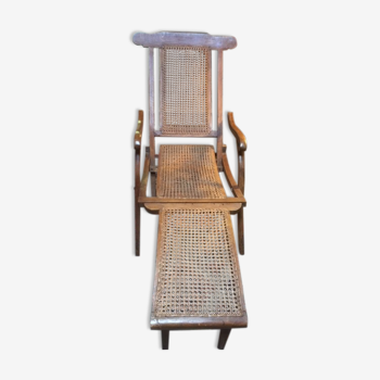 Ancienne chaise longue de paquebot cannée