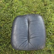 Egg chair style armchair and its ottoman.