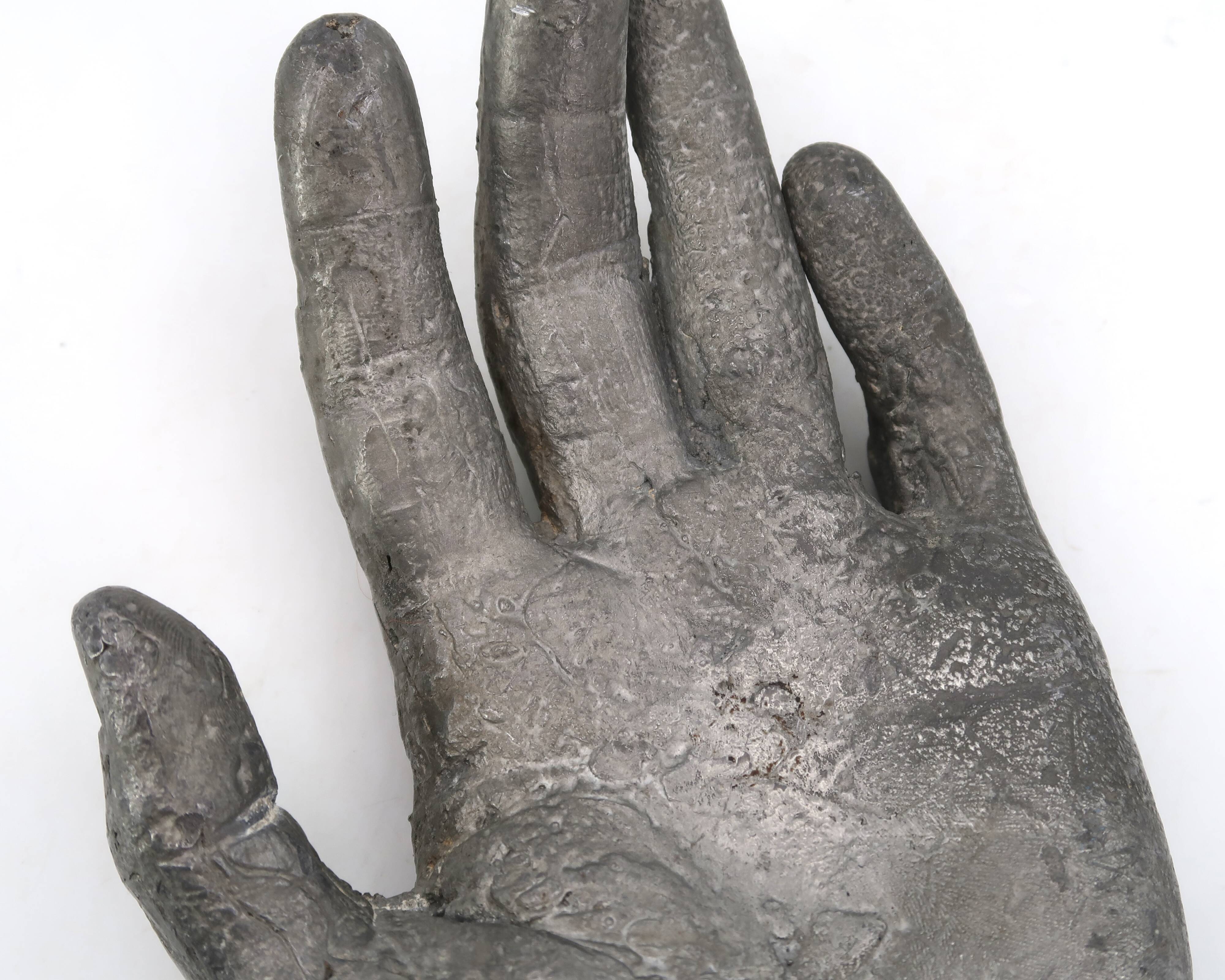 Cast iron silver-coloured catchall in the shape of a hand, 1970s sculpture.