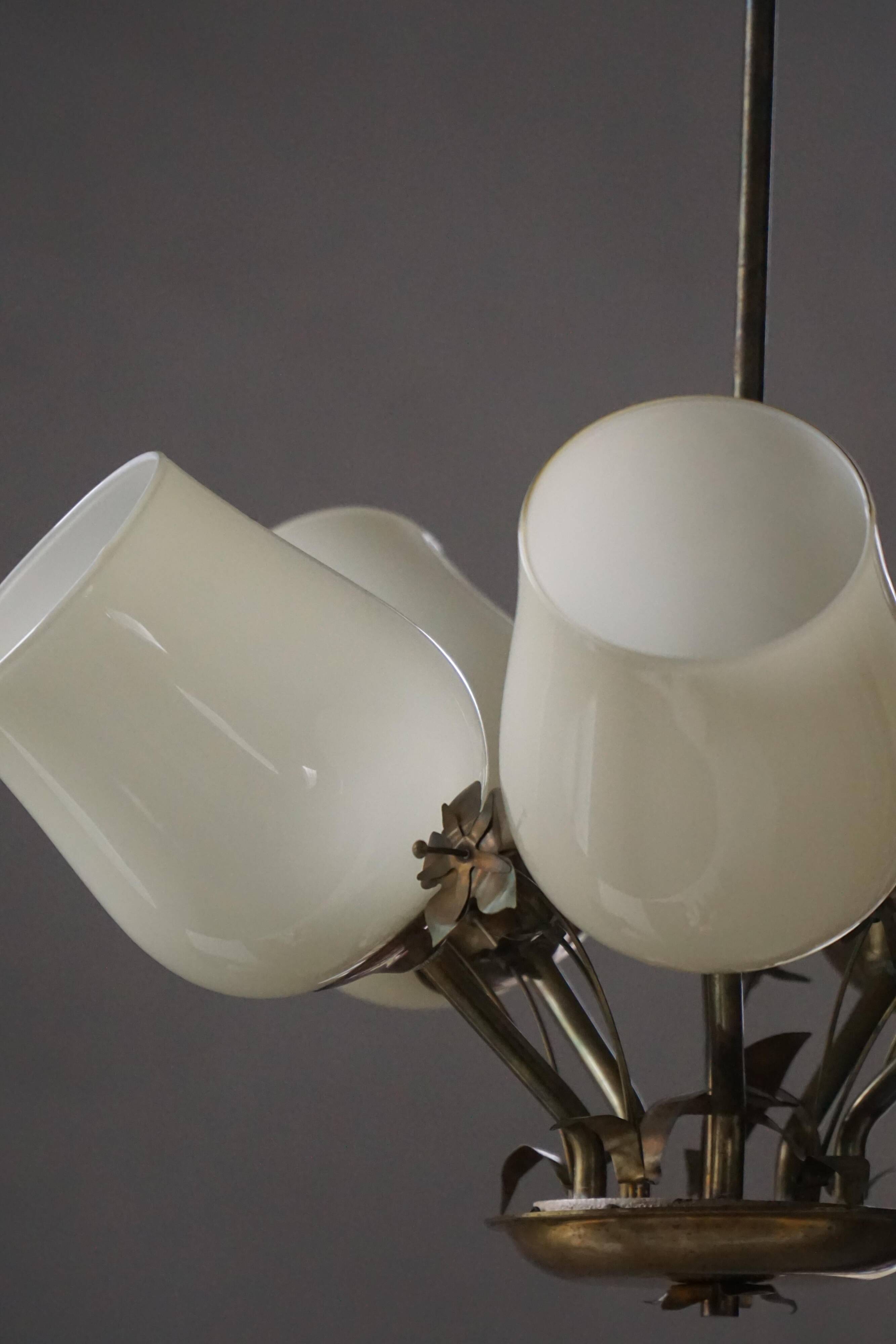 Five-branch brass and glass chandelier by Paavo Tynell for Idman OY Finland, 1940s.